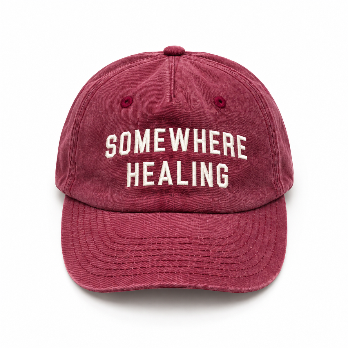Somewhere Healing Cap — Burgundy flat lay on white